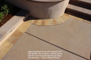 Light Sandwash Finish with Integral Color Tile Border. Stucco Walls to Match House with Pre Cast Concrete Bull Nosed Steps and Wall Caps - Color to Match Paving
