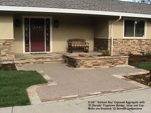 16” ‘Salmon Bay’ Exposed Aggregate with ‘El Dorado’ Flagstone Border, Inlay and Cap. Walls are Drystack ‘El Dorado’ Ledgestone 