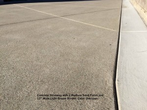 Concrete Driveway with a Medium Sand Finish and 12” Wide Light Broom Border. Color Unknown. Detail 