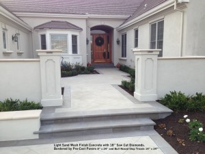 Light Sand Wash Finish Concrete with 18” Saw Cut Diamonds.  Bordered by Pre-Cast Pavers 9” x 24” and Bull Nosed Step Treads 14” x 24”’ 