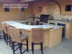 Kitchen-with-Smooth-Stucco-Walls-and-Granite-Counters-and-Backsplash-Tile-Wall-Detail-Exposed-Aggregate-Patio 