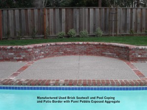 Manufactured-Used-Brick-Seatwall-and-Pool-Coping-and-Patio-Border-with-Pami-Pebble-Exposed-Aggregate    
